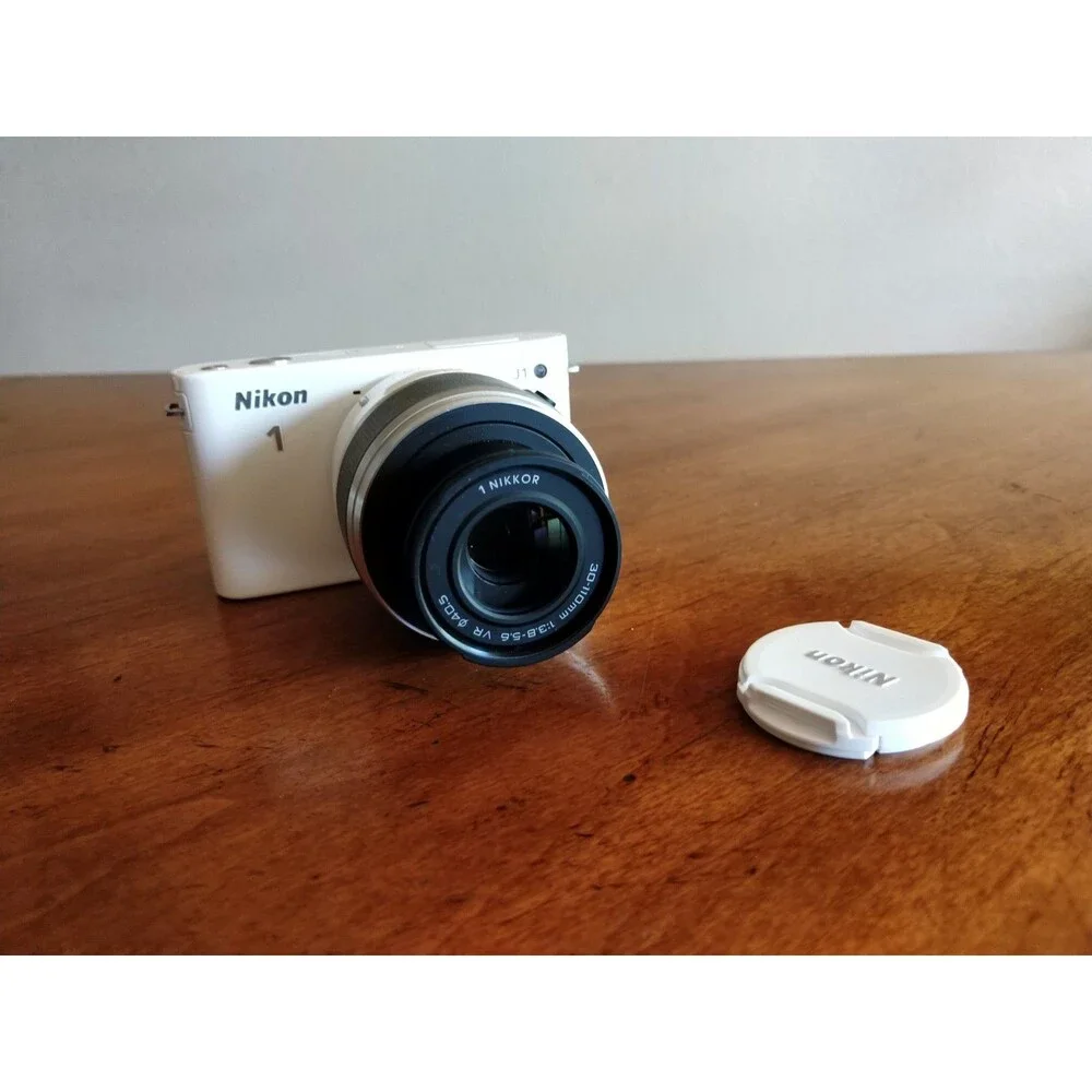 READ* Nikon 1 J1 White Digital Camera with 1 NIKKOR 10-30mm VR Lens